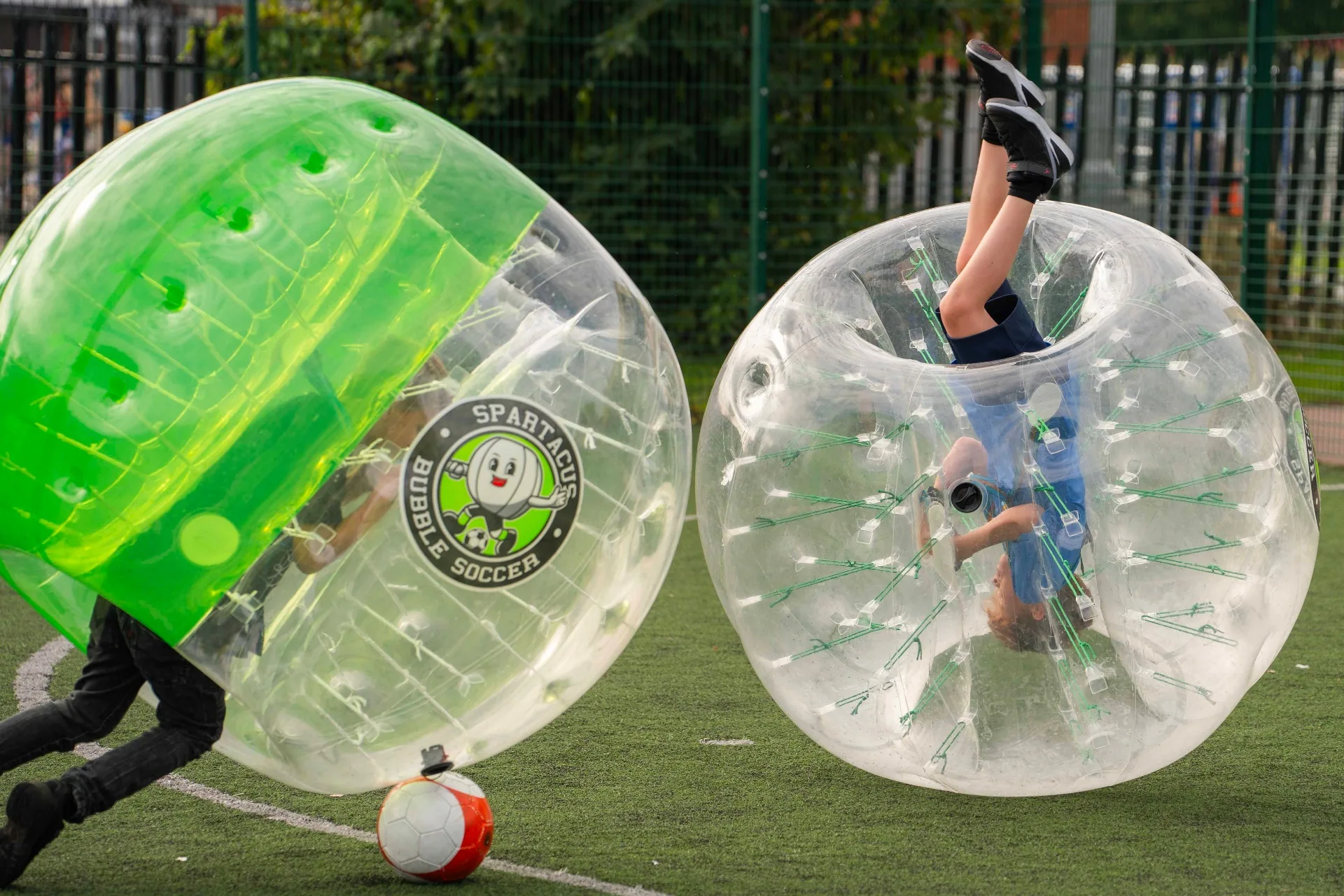 Kids crashing into each other in bubble suits